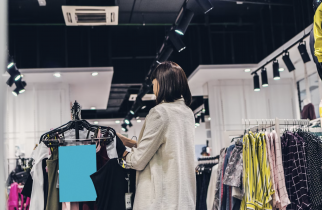 Woman Looking at Clothing in a Retail Store